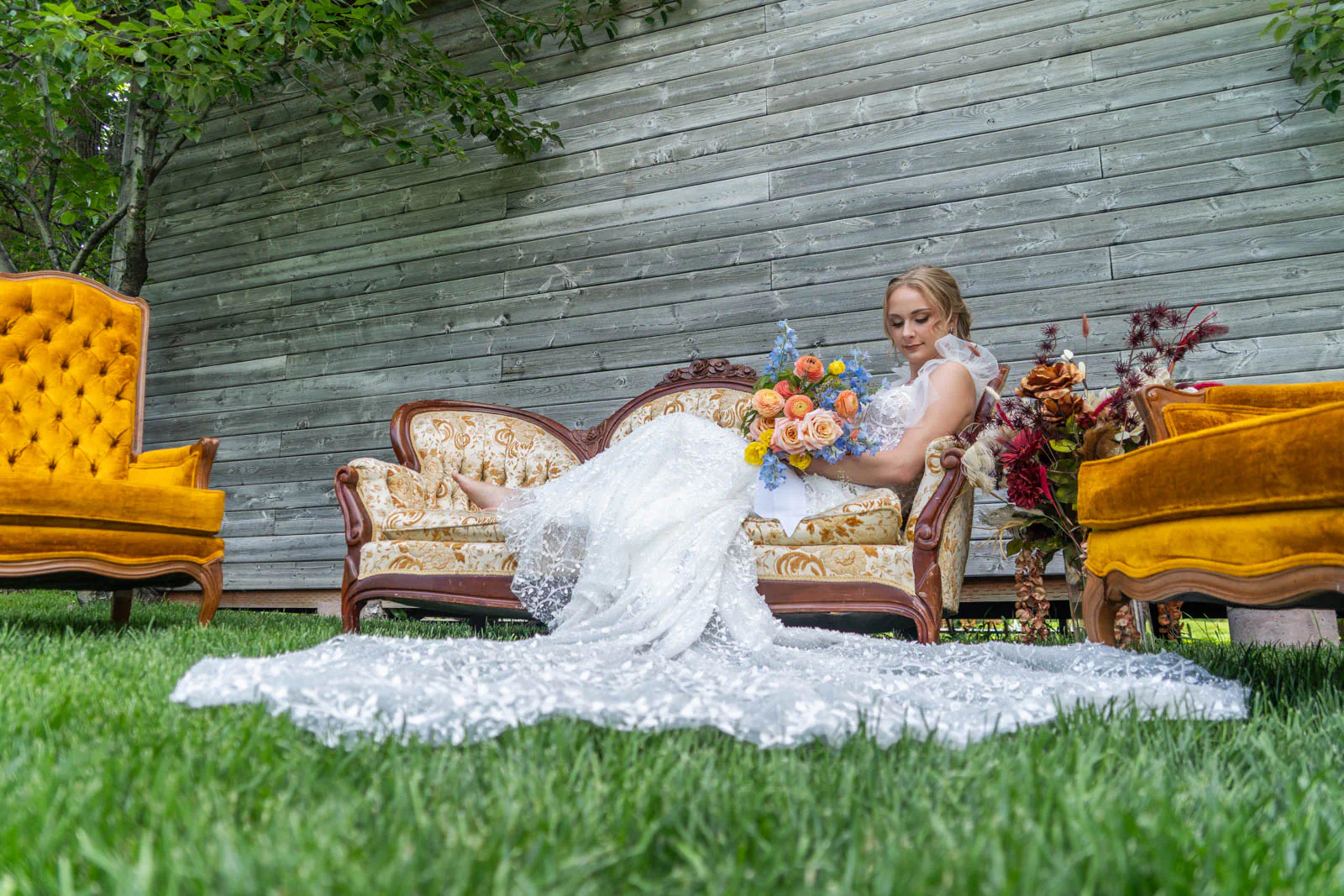 Bride on cute furniture at Montana Wildlflower Venue in Red Lodge, Montana