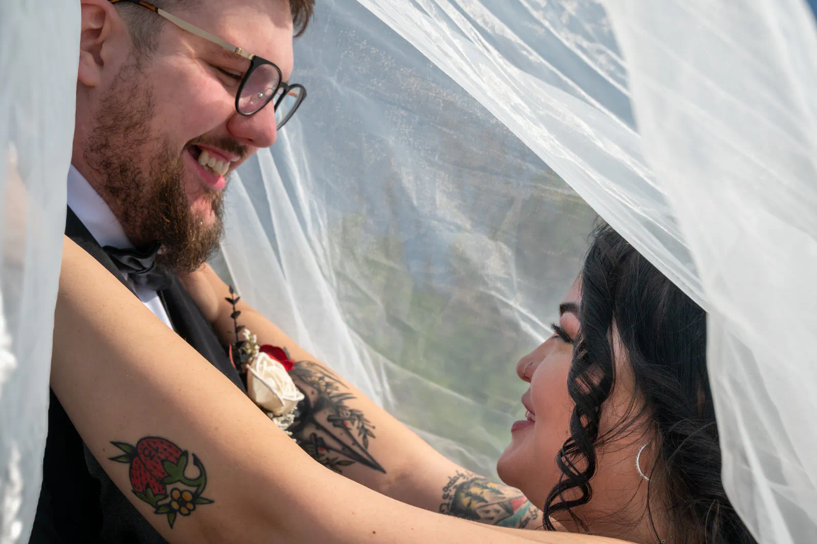 Bride and groom under the veil wedding photography