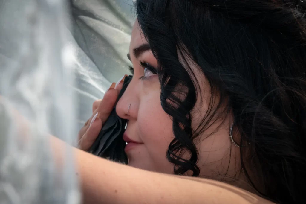 Bride wiping tears closeup
