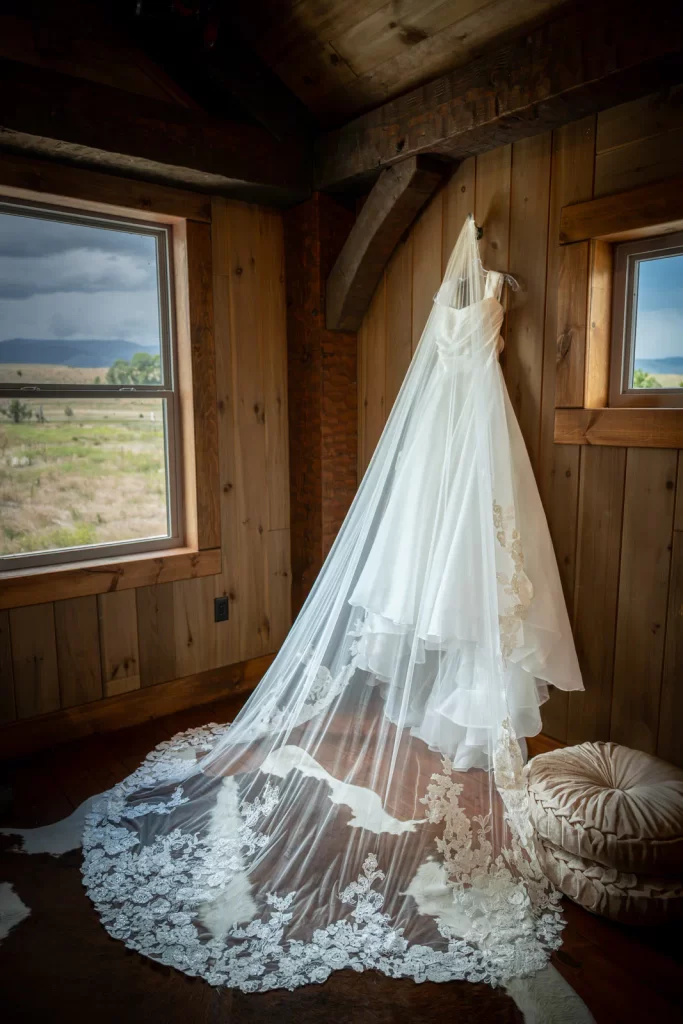 Bride's dress hanging in room alone