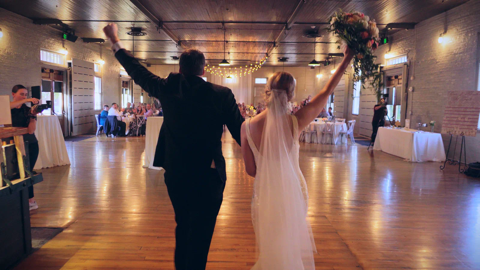Full simple edit _00_28_36;21_result Wedding couple entering Billings Depot reception